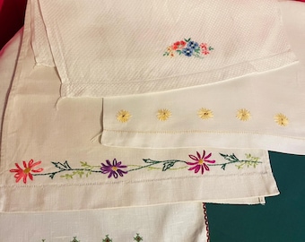 Four vintage embroidered huckaback hand towels