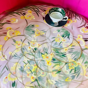 May include: A trio of ceramic canisters with lids, adorned with a blue and white floral design. The largest canister is about 20 cm tall. Ideal for storing kitchen items.