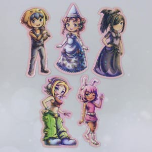 May include: A sheet of holographic stickers featuring five cartoon characters in various costumes. The characters include a person in a dog costume, a princess, a person in a dark dress, a person in a crop top and oversized pants, and a person in a pink dress with bunny ears.