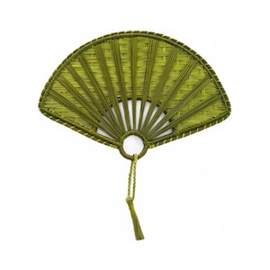 May include: A hand fan with a woven design in shades of green. The fan has a circular handle and a tassel. The fan's shape is a semi-circle, with a woven pattern radiating from the handle.