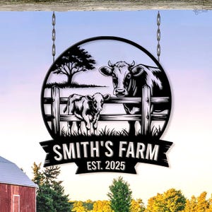 May include: Black metal farm sign featuring a cow and calf behind a fence, set within a circular frame. The sign reads "SMITH'S FARM EST. 2025" in a banner design. The sign hangs from chains, with a barn and landscape in the background.