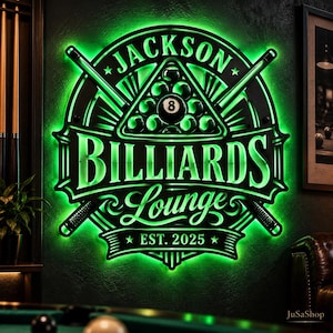 May include: A circular wall sign with bright green LED backlighting featuring the text JACKSON BILLIARDS LOUNGE EST. 2025. The design includes a rack of billiard balls with an 8-ball in the center and two crossed pool cues behind the emblem.
