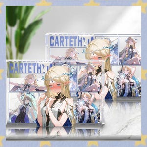 May include: Acrylic block featuring a manga-style illustration of a blonde-haired character with a crown and blue accents. The block has the word "CARTETH" printed on it. The artwork is displayed in a grid format, showcasing various poses of the character.