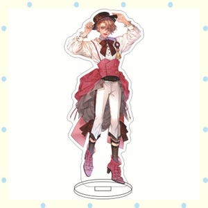 May include: A decorative acrylic stand featuring a character in a white shirt, red vest, and white pants. The character is wearing a brown hat and pink boots. The stand has a clear base.