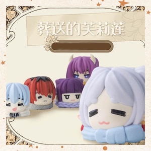 May include: A collection of anime-style figurines with various hair colors, including blue, red, and purple. Each figurine has a unique facial expression and is wearing a scarf or collar. The text "Flowers Sent" is visible in the background.