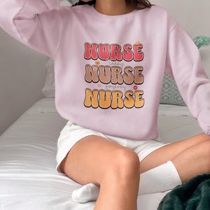 Funny Nurse Sweatshirt • RN Crewneck Sweater • Cute Nursing Student Gift • Cozy Medical Pullover • ER Nurse Appreciation Top