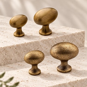 Antique Brass Egg Cabinet Knobs with Smooth or Distressed Surfaces