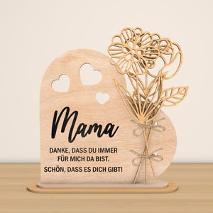 May include: Wooden heart-shaped sign with a floral design and the text "Mama" and "Danke, dass du immer f&uuml;r mich da bist. Sch&ouml;n, dass es dich gibt!"