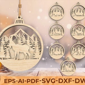 May include: Wooden Christmas ornaments with nature-themed designs. The ornaments feature mountain scenes with animals like bears, deer, and wolves. The main ornament has a large ram. The text "EPS-AI-PDF-SVG-DXF-DWG" is at the bottom.