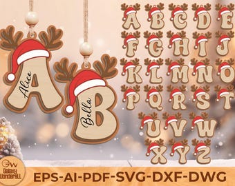 May include: Wooden Christmas ornaments in the shape of letters, each adorned with a red Santa hat and reindeer antlers. The letters "A" and "B" are personalized with names. The full alphabet is displayed, perfect for holiday decor.