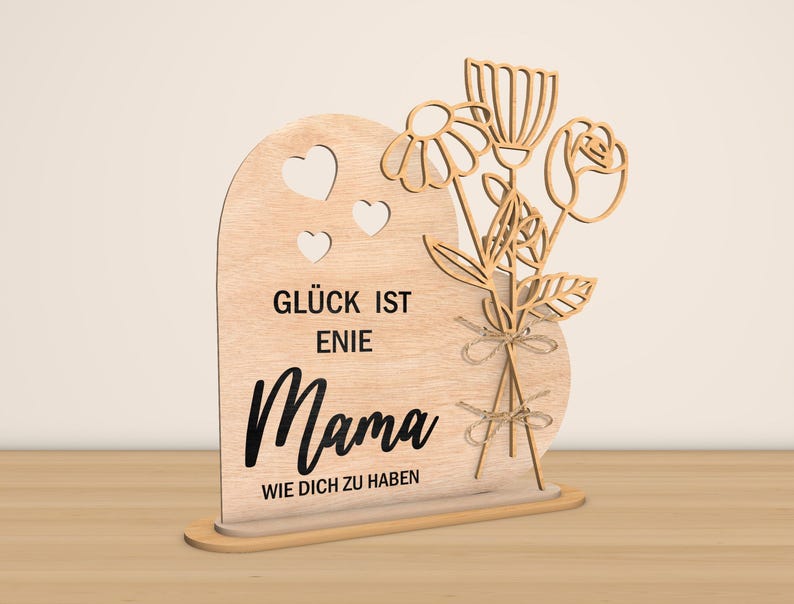 May include: Wooden sign with a heart shape and a bouquet of flowers. The sign reads "Gl&uuml;ck ist eine Mama wie dich zu haben" which translates to "Happiness is having a mom like you".