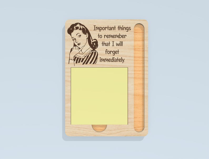 May include: Wooden memo board with a retro illustration of a woman and the text "Important things to remember that I will forget immediately." The board has a yellow sticky note pad and a slot for a pen.