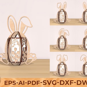 Pode incluir: Desenho de coelho da Páscoa de madeira cortado a laser com forma de ovo oco. O coelho tem orelhas compridas e o ovo tem um desenho floral. O desenho está disponível em vários formatos de arquivo: EPS, AI, PDF, SVG, DXF e DWG.