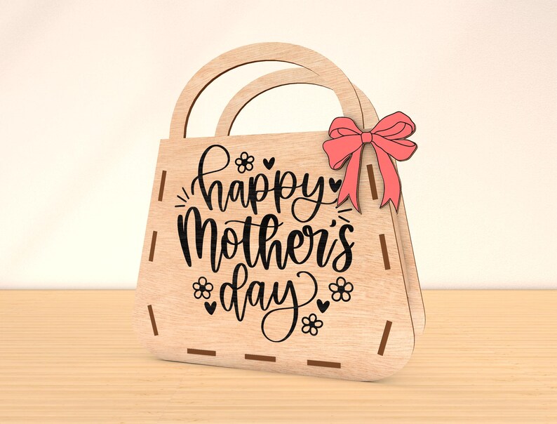 May include: Wooden handbag with a pink bow and the text "Happy Mother's Day" in black script.