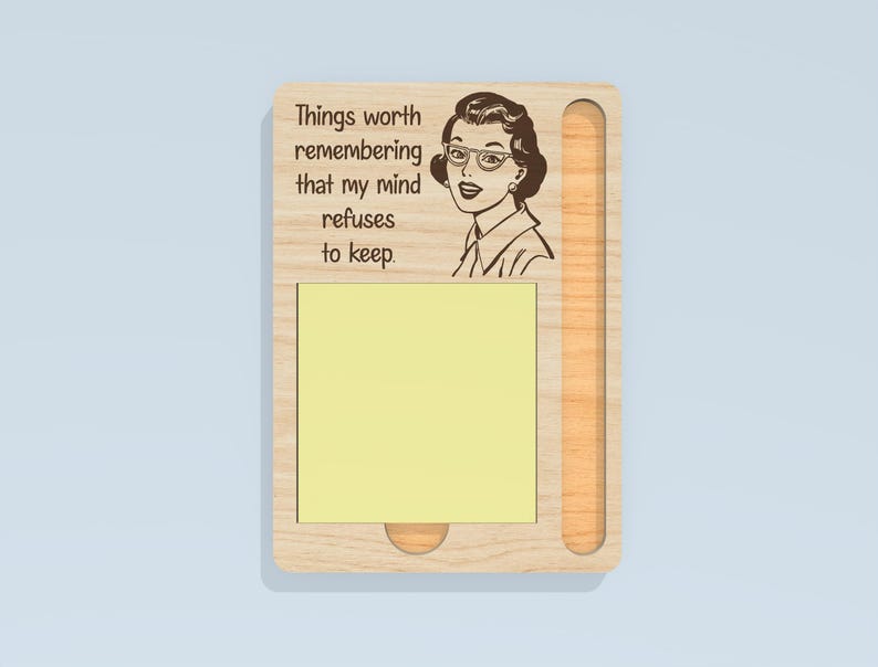 May include: Wooden memo board with a retro illustration of a woman wearing glasses. The board has a slot for a notepad and the text "Things worth remembering that my mind refuses to keep."
