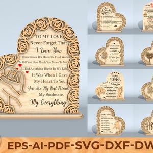 May include: Wooden heart-shaped decorative plaques with laser-cut floral and text designs. The plaques feature romantic messages, including "I Love You" and "My Everything." The design includes a couple embracing. The plaques are suitable for gifting.