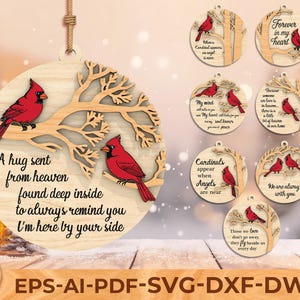 May include: Wooden Christmas ornaments with red cardinal bird designs. One ornament features a cardinal on a tree branch with the text "A hug sent from heaven found deep inside to always remind you I'm here by your side."