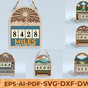 Peut inclure: Panneau en bois pour le suivi de la course à pied, avec un design de montagne et de soleil. Le compteur affiche "8428 MILES RUN THIS YEAR" avec une silhouette de coureur. Comprend une corde de suspension. Autres compteurs pour le cyclisme et la randonnée.