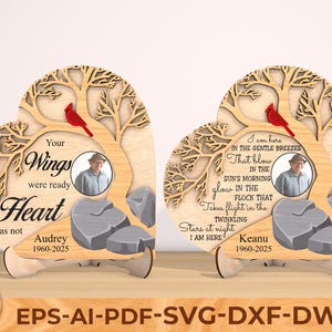 May include: Wooden heart-shaped memorial with a tree design, a red cardinal, and a photo frame. The text reads "Your Wings were ready but my Heart was not" and the name "Audrey 1960-2025".