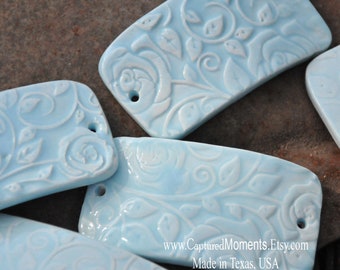 Pottery cuff bead in a Soft Blue with Roses