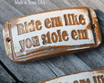 Ceramic Pottery Cuff Bead "Ride em like you stole em" a handmade pottery cuff bead with an attitude in a rustic brown with patina green