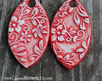 2 Handmade Pottery Beads in a Red in a small floral design