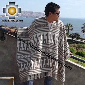 May include: A beige and brown poncho with a geometric and llama pattern. The poncho has a V-neck and fringe along the bottom. The image includes the text "www.incastreasures.com".