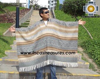May include: A gray, brown, and beige poncho with a geometric pattern and fringe. The poncho is worn by a person standing on outdoor steps. The website address www.incastreasures.com is printed on the poncho.