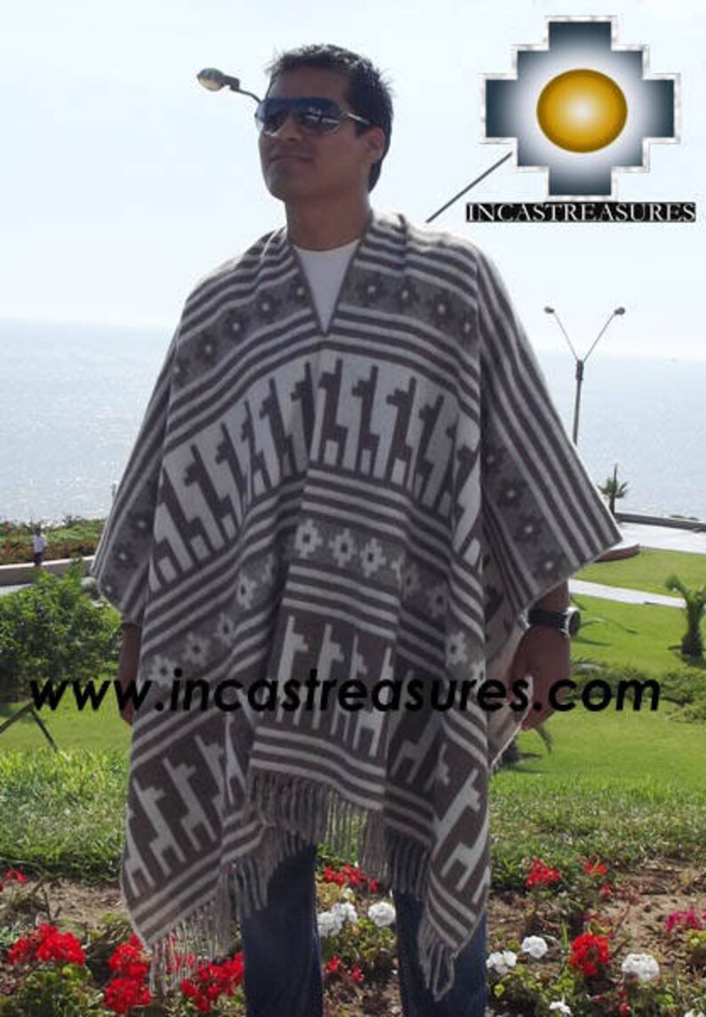 May include: A gray and white poncho with a geometric pattern featuring llama figures and striped borders. The poncho has a fringed hem and is worn outdoors. The logo "INCASTREASURES" is visible in the upper right corner.