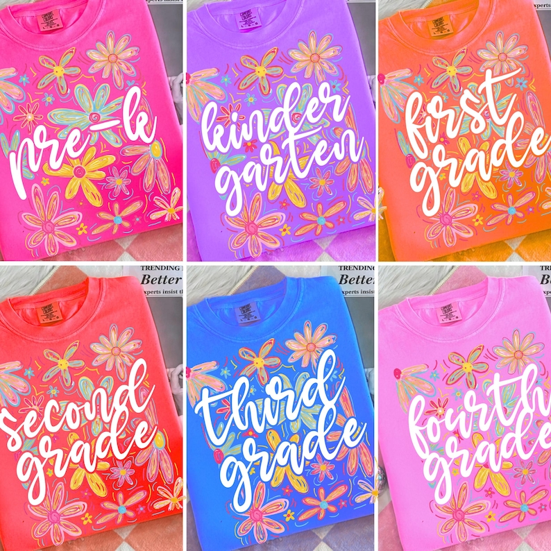 May include: A collection of colorful crewneck sweatshirts, each displaying a grade level from Pre-K to Fourth Grade. The shirts are in various colors, including pink, purple, orange, red, and blue, and are adorned with floral designs.