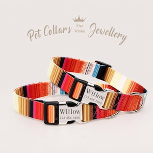 May include: Two colourful pet collars with a striped pattern in red, orange, yellow, black, and blue. Each collar has a silver buckle engraved with the name "Willow" and a phone number. The collars are designed as pet jewellery.