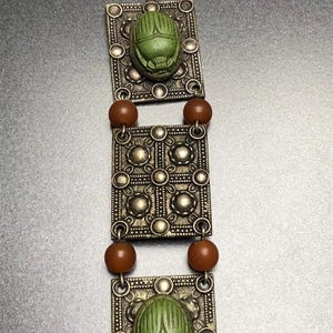 Vintage 1930s Egyptian Revival galalith scarab beetle & lightweight brass colour, orange and green panel bracelet, adjustable, hook clasp