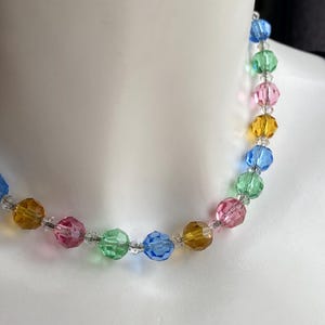 Vintage art deco 1920s pastel pink, blue, green, yellow harlequin Czech faceted glass bead necklace, strung on a chain, spring ring clasp