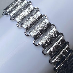 Bracciale vintage anni &#39;50 in argento con catena a libro: gioielli da cocktail in stile francese