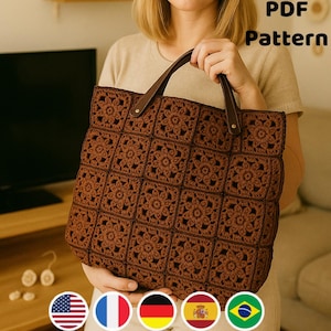 May include: A brown crocheted tote bag with a floral pattern. The bag has brown leather handles and is held by a person. The text "PDF Pattern" is visible in the upper right corner.