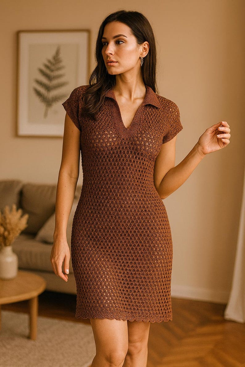 May include: A brown, short-sleeved, crochet dress with a collared neckline and a V-neck. The dress has a fitted silhouette and a scalloped hemline. The model is wearing the dress in a well-lit room.