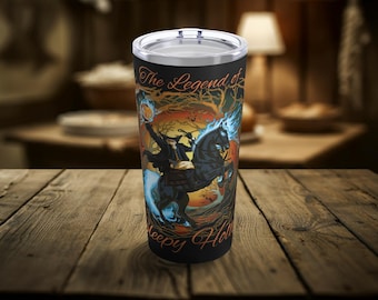 May include: A black and blue stainless steel tumbler with a graphic of a person riding a horse with the text "The Legend of Sleepy Hollow".