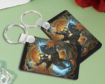 May include: A black and blue key chain with a spooky Halloween design featuring a rider on a flaming horse. The design is set against a dark forest background with a full moon.