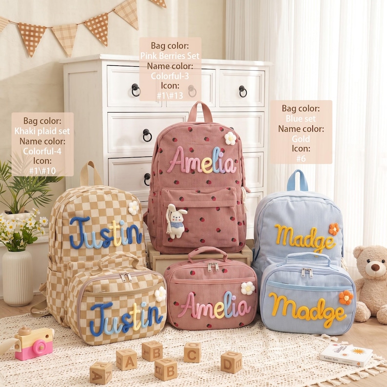 May include: Three sets of corduroy backpacks and lunch bags in khaki plaid, pink with berry patterns, and light blue. Each item features personalized names in colorful or gold raised lettering, small flower accents, and a plush bunny charm.