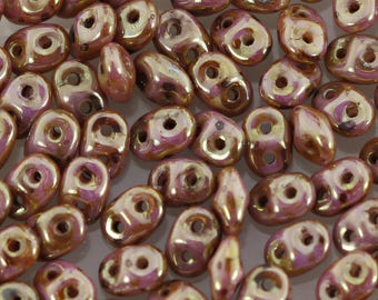 SuperDuo 2x5mm 2-Hole Czech Glass Seed Beads Rose Gold Topaz Opaque Luster - P64591 Czech Glass Bead - Sold in 10 Gram Bag