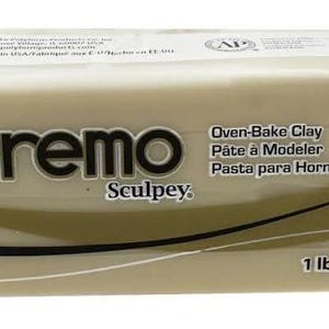 May include: A rectangular block of off-white Premo Sculpey oven-bake clay. The packaging features the brand name, the text Oven-Bake Clay, Pâte à Modeler, Pasta para Hornear, and a weight of 1 lb (454 g) printed on the front in black and gold.