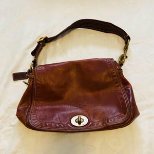 Coach Vintage - 65th Anniversary Legacy Ali Turnlock Flap Bag in Distressed Oiled Leather, color Tobacco Whiskey