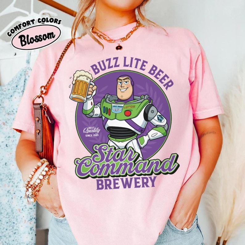 May include: A white ceramic mug with a black handle and the text "But First, Coffee" in a handwritten style. The mug is on a white surface. The mug is approximately 4 inches tall.