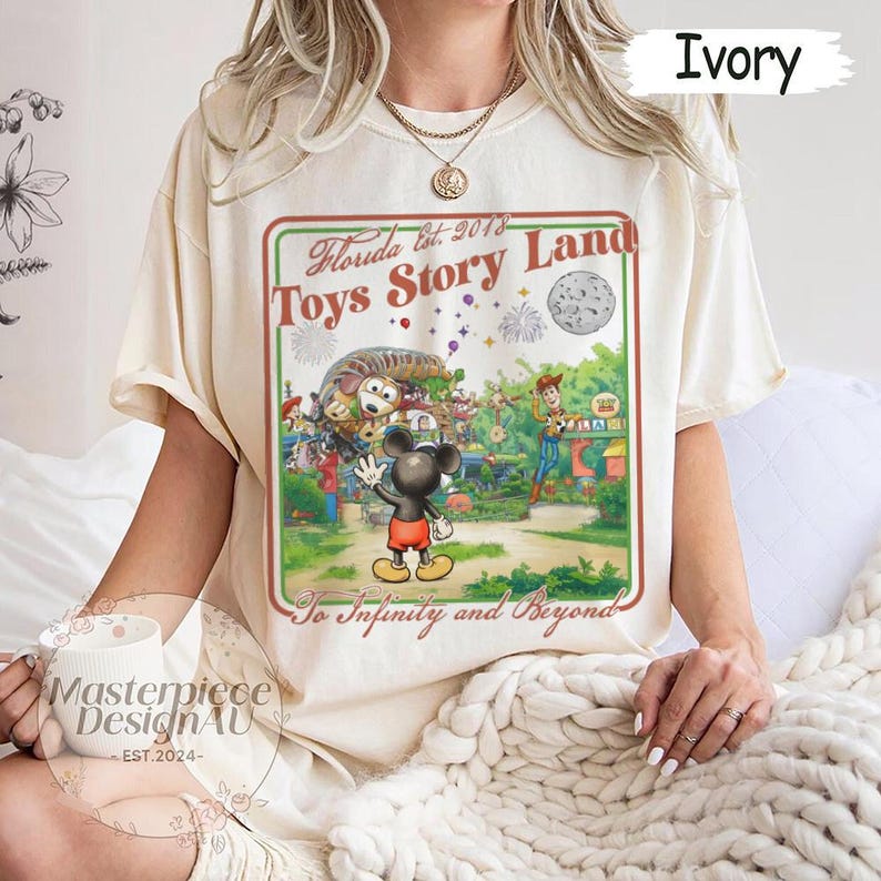 May include: A white ceramic mug with a black handle and the text "But First, Coffee" in a black, handwritten-style font. The mug is on a white surface.