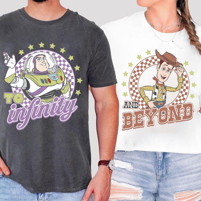 May include: Two t-shirts featuring characters from Toy Story. One is dark gray with Buzz Lightyear and the text "To Infinity". The other is white with Woody and the text "And Beyond". Both designs are surrounded by stars.