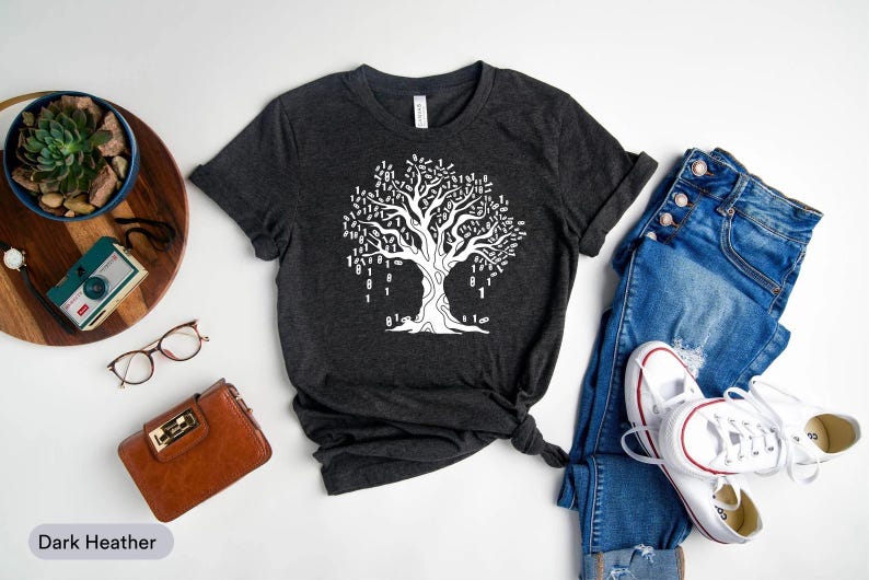 a casual outfit consisting of a black t-shirt with a tree graphic, a pair of blue jeans, white sneakers, and a brown wallet.