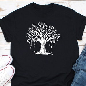 a black t - shirt with a white tree on it