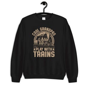 a black sweatshirt with a train on it