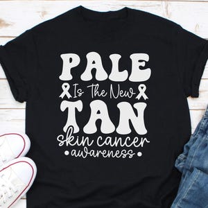 Camiseta de conscientização sobre o câncer de pele Pale Is The New Tan, presente, suporte ao câncer de melanoma, camiseta de guerreiro do câncer de melanoma, camiseta de lutador do câncer de pele, presente