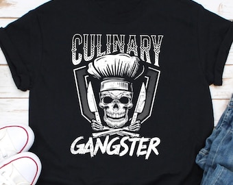 May include: Black t-shirt with a white graphic of a skull wearing a chef's hat and holding two knives. The text "CULINARY GANGSTER" is below the skull.